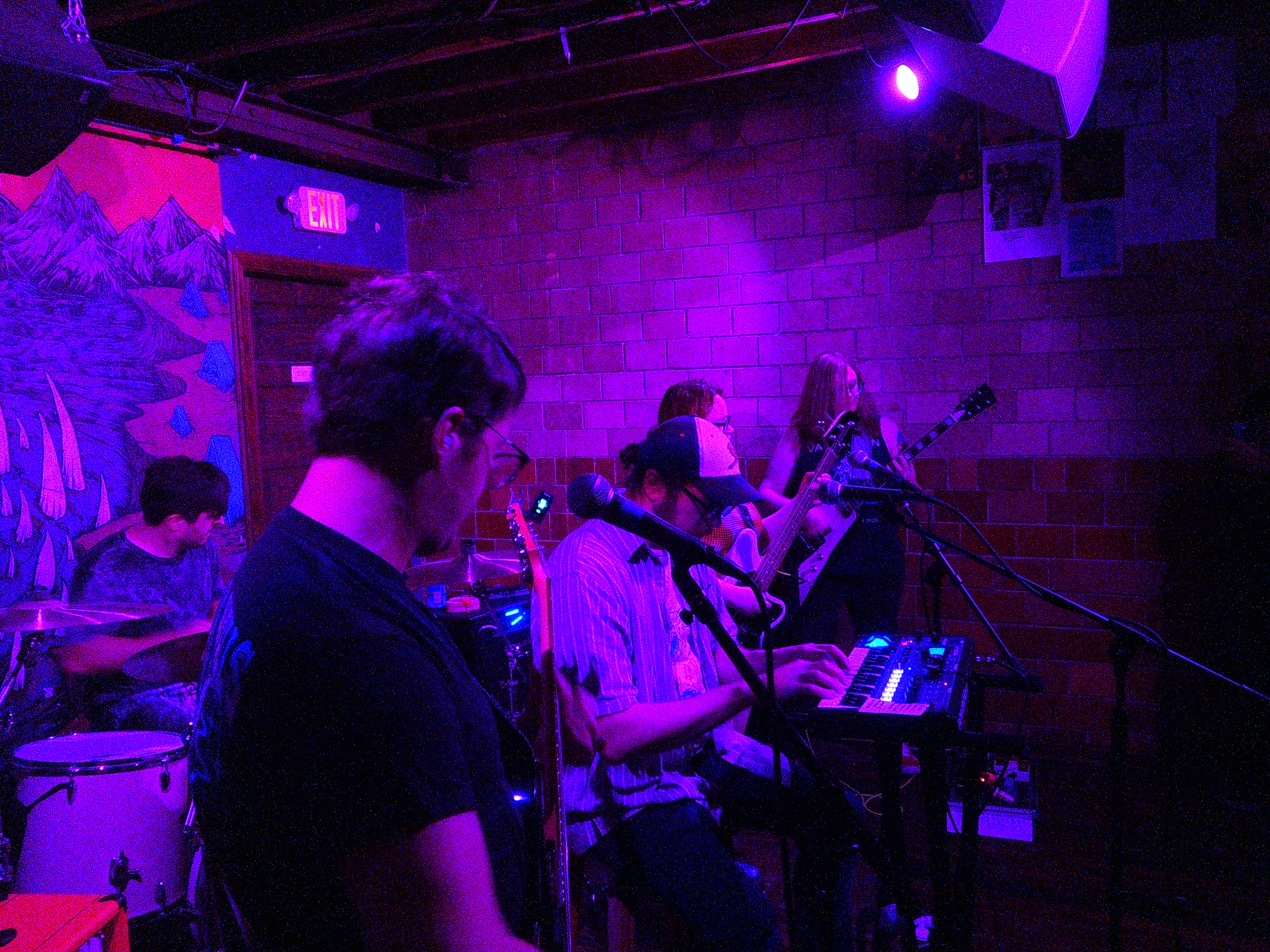 David playing guitar, Adam playing drums, Ray playing keys, Haley playing bass, and Lindsay playing guitar